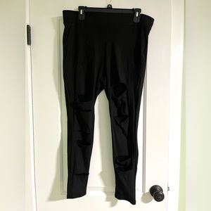 Torrid black slashed/fishnet leggings, size 2